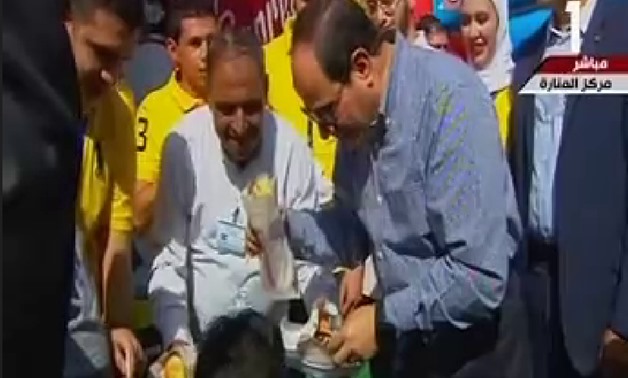 President Abdel Fatah al-Sisi attended on Friday celebrations of Eidul Fitr with the families of the nation's martyrs - TV Screenshot