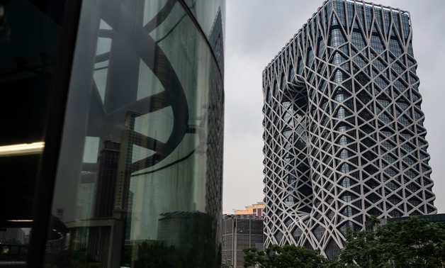 This picture shows a general view of Melco International's 1.1-billion USD "Morpheus" resort (R) in Macau, designed by the late star architect Zaha Hadid, on June 15, 2018. -  AFP / Philip FONG
