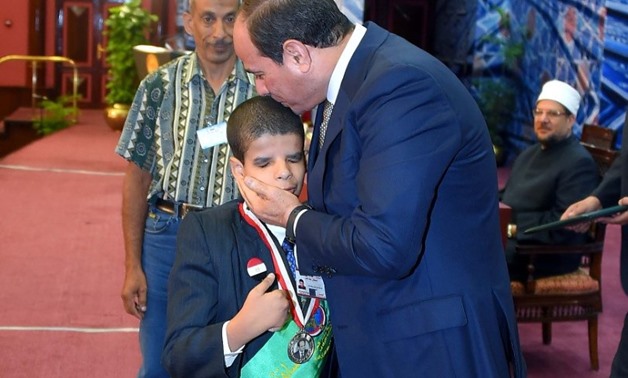 President Sisi honors a Quran reciter with special needs who is under 12 years old - Press photo/Sherif Abdel Moneim