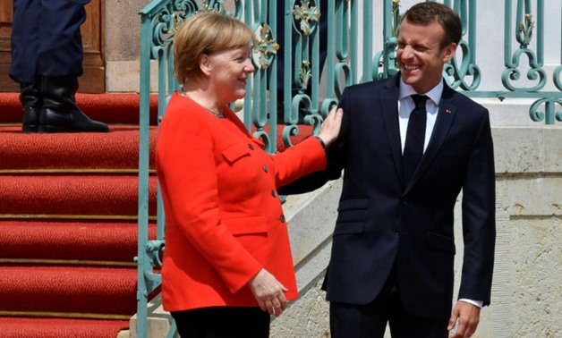 French President Emmanuel Macron has been at pains to work closely with German Chancellor Angela Merkel as she faces an internal migrant row
