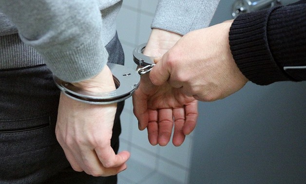 FILE – handcuffed person/pixabay