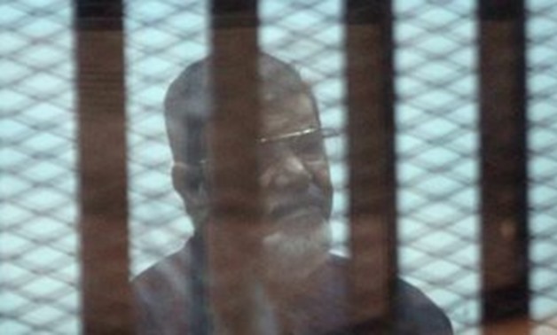FILE- Former President Mohamed Morsi in a trial session – Press photo