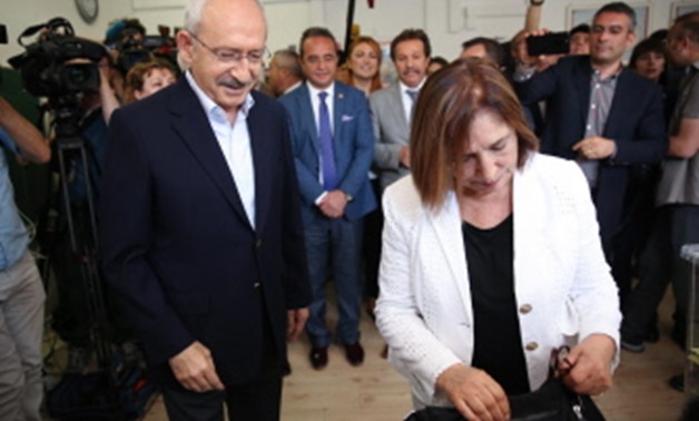 emal Kilicdaroglu, the leader of Turkey's main opposition Republican People's Party (CHP) and his wife Selvi Kilicdaroglu (R) stand at a polling station during snap twin Turkish presidential and parliamentary elections in Ankara, on June 24, 2018. Turks b