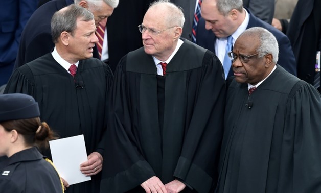 The departure of Justice Anthony Kennedy (C), pictured in January 2017, will give President Donald Trump a chance to shift the top US court decisively to the right
