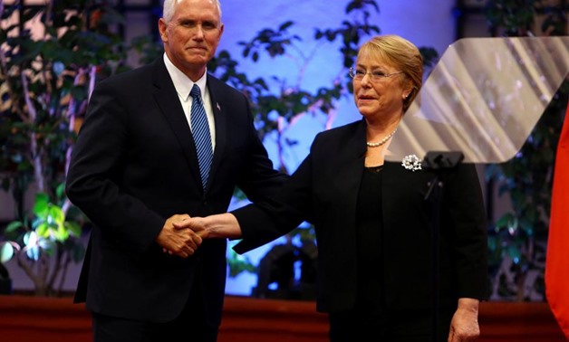 Chile's President Michelle Bachelet and U.S. Vice President Mike Pence shake hands during an official ceremony at the government house in Santiago, Chile August 16, 2017. REUTERS/Ivan Alvarado
