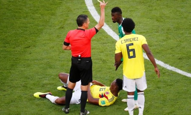 Soccer Football - World Cup - Group H - Senegal vs Colombia - Samara Arena, Samara, Russia - June 28, 2018 Senegal's M'Baye Niang is shown a yellow card by referee Milorad Mazic REUTERS/David Gray

