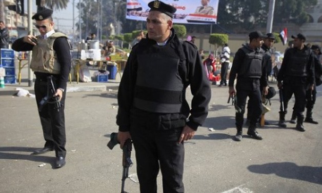Policemen standing in Cairo streets - Reuters
