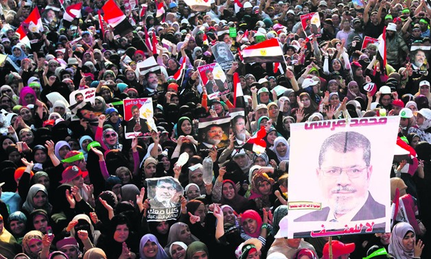 Thousands of former President Mohamed Morsi supporters protesting outside his place of detention in Cairo, July 2013 Photo – Reuters