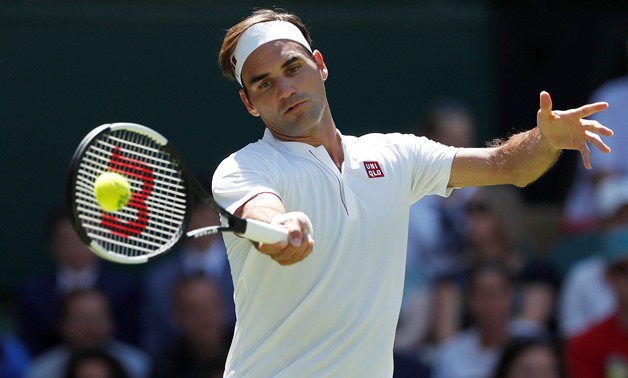 Tennis - Wimbledon - All England Lawn Tennis and Croquet Club, London, Britain - July 2, 2018 Switzerland's Roger Federer in action during the first round match against Serbia's Dusan Lajovic. REUTERS/Andrew Boyers
