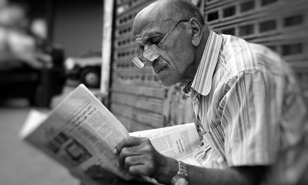 An Arabic man reading a newspaper in Hamra, Beirut, Lebanon, November, 2010 – Flickr/Thomas Leuthard