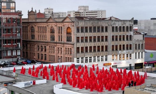 Subjects pose for contemporary New York artist Spencer Tunick, who is photographing nude Melburnians for his latest piece, 'Return of the Nude', as part of Chapel st, Prahran's Provocare festival, in Melbourne, Australia, July 9, 2018. AAP/Penny Stephens/