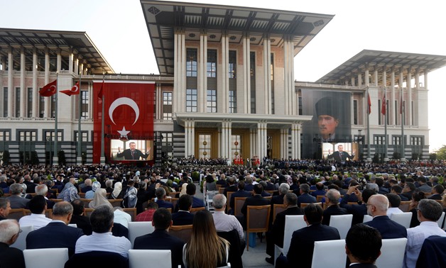 Turkish President Tayyip Erdogan, accompanied by his wife Emine Erdogan, makes a speech during a ceremony at the Presidential Palace in Ankara, Turkey July 9, 2018. REUTERS/Umit Bektas