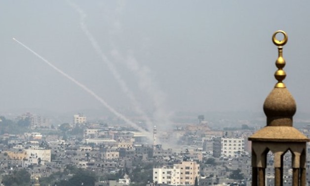 A picture taken on July 14, 2018, shows Palestinian rockets being fired from Gaza City towards Israel - Bashar Taleb, AFP
