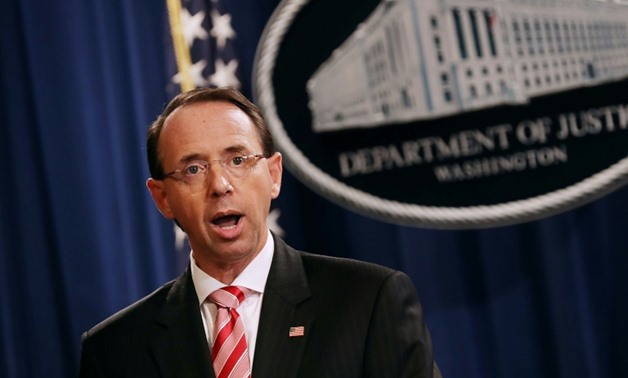 US Deputy Attorney General Rod Rosenstein told reporters 12 Russian military officers were accused of "conspiring to interfere with the 2016 presidential election"
