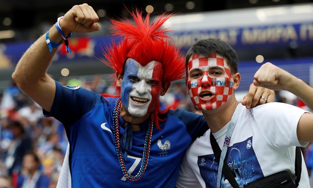 Soccer Football - World Cup - Final - France v Croatia - Luzhniki Stadium, Moscow, Russia - July 15, 2018 France fan and a Croatia fan pose for a photo inside the stadium before the match REUTERS/Darren Staples

