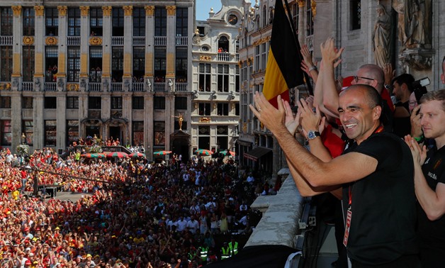 Soccer Football - World Cup - Belgium - Brussels, Belgium - July 15, 2018. Belgian soccer team coach Roberto Martinez waves to the fans while appearing on the balcony of the city hall at the Brussels' Grand Place, after taking the third place in the World