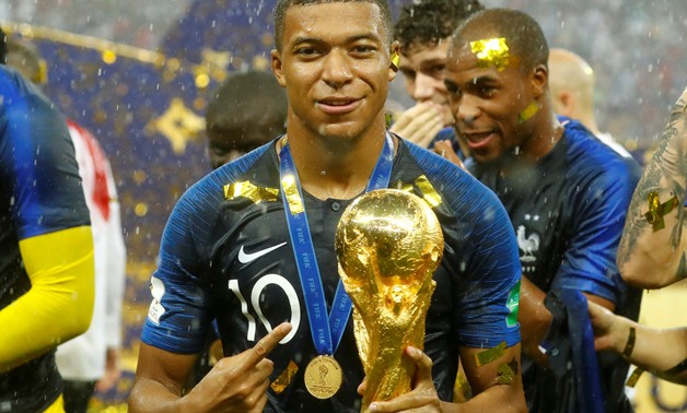 Soccer Football - World Cup - Final - France v Croatia - Luzhniki Stadium, Moscow, Russia - July 15, 2018 France's Kylian Mbappe celebrates with the trophy after winning the World Cup REUTERS/Kai Pfaffenbach 