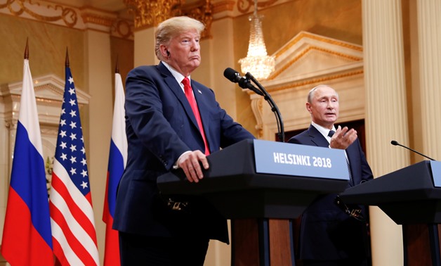 Russia's President Vladimir Putin gestures during a joint news conference with U.S. President Donald Trump after their meeting in Helsinki, Finland, July 16, 2018. REUTERS/Kevin Lamarque
