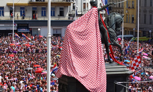 Soccer Football - World Cup - The Croatia team return from the World Cup in Russia - Zagreb, Croatia - July 16, 2018 General view of a flag tied around the Ban Jelacic statue as Croatia fans await the arrival of the team at the main square in Zagreb REUTE