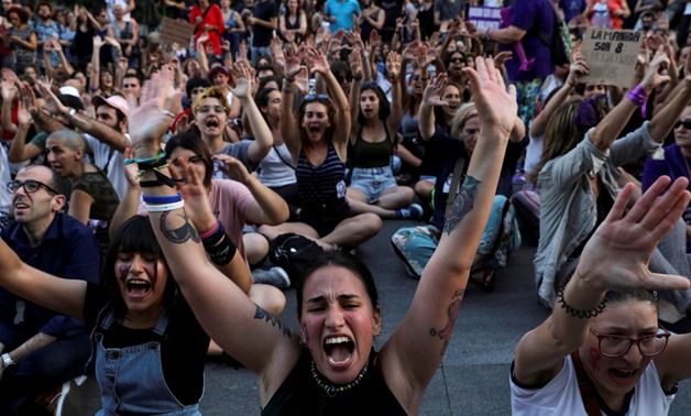 REFILE - ADDING RESTRICTION FILE PHOTO: Protesters do a sit down in front of the Spanish Parliament during a demonstration against the release on bail of five men known as the "Wolf Pack" cleared of a gang rape of a teenager and convicted of a lesser crim