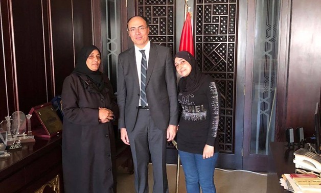 Egypt's charge d'affaires in Syria Mohamed Tharwat Selim with the Egyptian family - Press photo/Ministry of Foreign Affairs