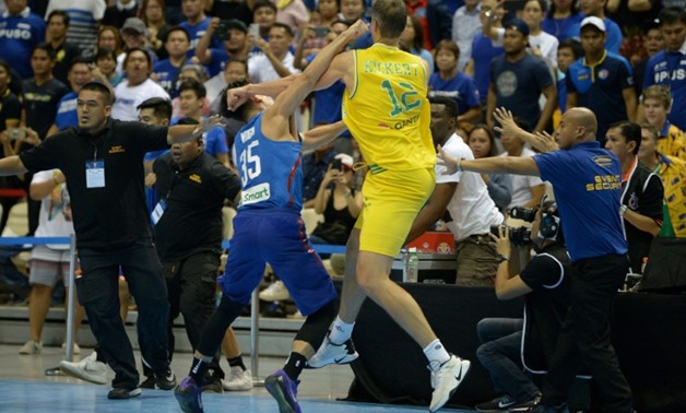 Basketball's governing body suspended 10 players and two coaches from the Philippines national squad after a match against Australia in Manila descended into an ugly brawl
AFP/File / TED ALJIBE
