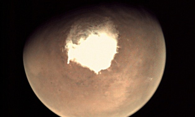 This handout picture released on October 16, 2016 by the European Space Agency (ESA) shows planet Mars as seen by the webcam on ESA’s Mars Express orbiter, as another mission, ExoMars, is about to reach the Red Planet
