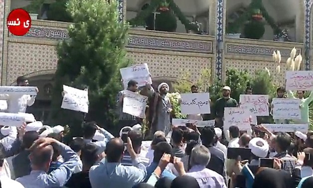 A cleric speaks to protesters in the holy city of Mashhad on August 3, 2018, from a video by Nasim News Agency
