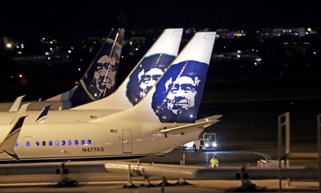 Alaska Airlines planes sit on the tarmac at Sea-Tac International Airport, Aug. 10, 2018, in SeaTac, Wash. An airline employee stole an Alaska Airlines plane without any passengers and took off from Sea-Tac International Airport in Washington state Frida