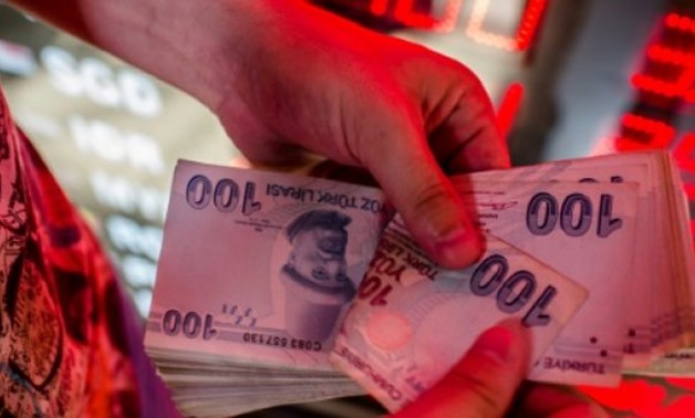 © AFP | Three, four, five, six lira to the dollar, and counting

