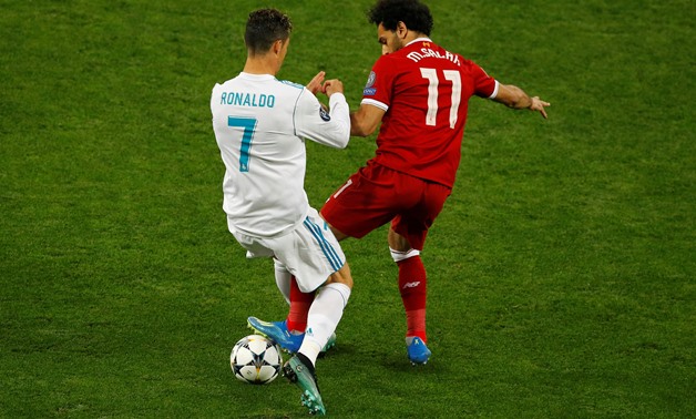 FILE PHOTO: Soccer Football - Champions League Final - Real Madrid v Liverpool - NSC Olympic Stadium, Kiev, Ukraine - May 26, 2018 Real Madrid's Cristiano Ronaldo in action with Liverpool's Mohamed Salah REUTERS/Phil Noble/File Photo
