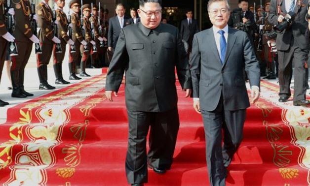 © AFP, The Blue House | This handout released on May 27, 2018 shows South Korea's President Moon Jae-in (R) and North Korea's leader Kim Jong Un (L) walking together after the summit in the Demilitarized Zone (DMZ) between the two Koreas.
