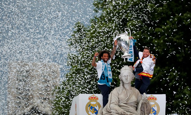 FILE PHOTO: Soccer Football - Real Madrid celebrate winning the Champions League Final - Madrid, Spain - May 27, 2018 Real Madrid's Sergio Ramos and Marcelo celebrate during victory celebrations REUTERS/Paul Hanna/File Photo
