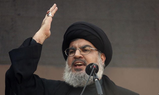 Lebanon's Hezbollah leader Sayyed Hassan Nasrallah addresses his supporters during a religious procession to mark Ashura in Beirut's suburbs November 14, 2013. REUTERS/Khalil Hassan
