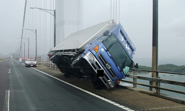 A truck is toppled by typhoon winds on the Seto Ohashi bridge in Sakade
