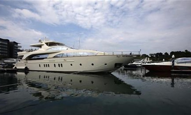A luxury yacht is berthed at the One Degree 15 Marina Club at Sentosa Cove in Singapore April 25, 2012. REUTERS/Tim Chong