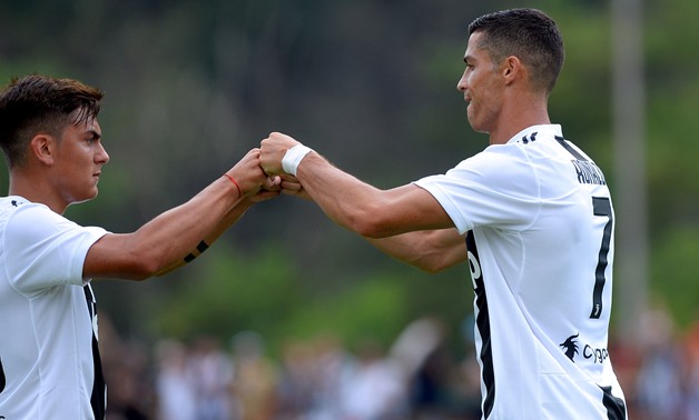 Turin, Italy - August 12, 2018 Juventus' Cristiano Ronaldo with Paulo Dybala REUTERS/Massimo Pinca/File Photo