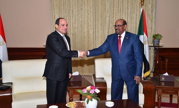 File - President Abdel Fatah al-Sisi and his Sudanese counterpart President Omar Bashir in Khartoum on July 19, 2018
