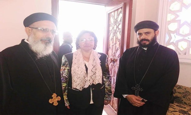 Parliamentarian Fayka Fahim with Coptic citizens outside the mosque/Eman Mehanna