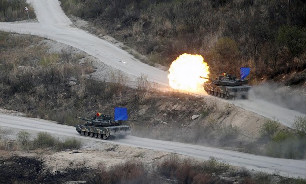 FILE PHOTO: South Korean Army K1A1 tanks fire live rounds during a U.S.-South Korea joint live-fire military exercise at a training field, near the demilitarized zone, separating the two Koreas in Pocheon, South Korea April 21, 2017. REUTERS/Kim Hong-Ji
