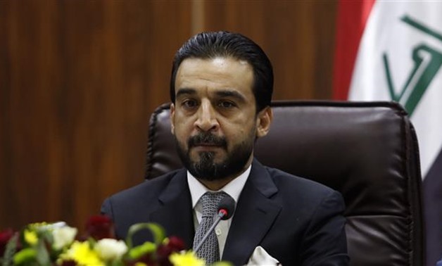 FILE- Newly elected parliament speaker Mohammed al-Halbousi heads a meeting at the local government headquarters during his visit to the southern city of Basra on September 18, 2018. AFP