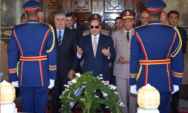 Sisi and Defense Ministry officials head to lay a wreath of flowers on the Unknown Soldier Memorial in Nasr City on October 4, 2018- Press photo