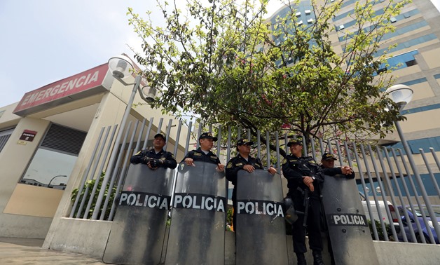 Policemen stand guard outside the Centenario Clinic in Lima on October 4, 2018, where former Peruvian president (1990-2000) Alberto Fujimori was admitted on October 3 after a court annulled his pardon.
