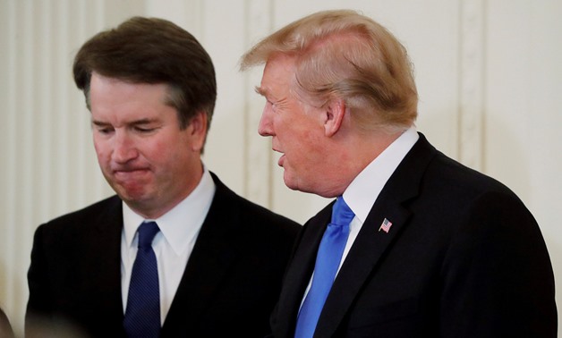 U.S. President Donald Trump talks with his nominee for the U.S. Supreme Court, Brett Kavanaugh, at his nomination announcement in the East Room of the White House in Washington, July 9, 2018. Picture taken July 9, 2018. REUTERS/Jim Bourg/File Photo