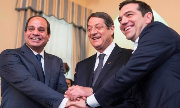 President Abdel Fatah al-Sisi (l), Cypriot President Nicos Anastasiades, and Greek Prime Minister Alexis Tsipras (r) in the sixth Tripartite Summit in Crete. October 10, 2018. Press Photo