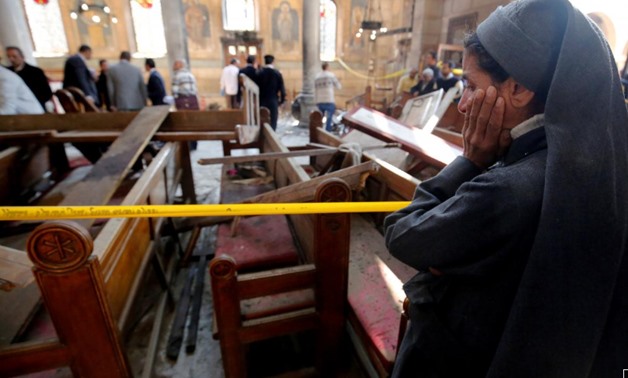 FILE PHOTO: A nun cries at the scene of the bombing inside Cairo's Coptic cathedral, December 11, 2016. REUTERS/Amr Abdallah Dalsh/File Photo
