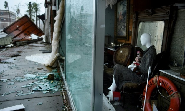 A mannequin in a window display in Panama City, Florida, after Hurricane Michael
