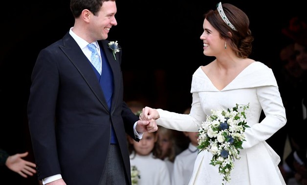 Britain's Princess Eugenie and Jack Brooksbank leave the St George's Chapel after their wedding at Windsor Castle, Windsor, Britain October 12, 2018.
