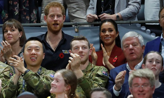 Britain's Prince Harry and Meghan, Duchess of Sussex, react as they watch the Invictus Games Sydney 2018 wheelchair basketball gold medal match at Quaycentre in Sydney, Australia October 27, 2018. REUTERS/Phil Noble
