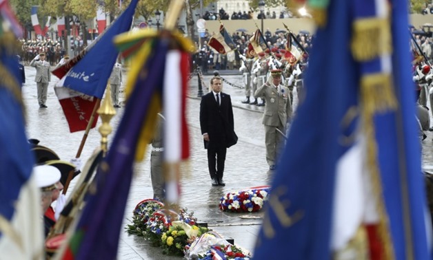 French President Emmanuel Macron took part in last year's remembrance ceremony at the Tomb of the Unknown Soldier at the Arc de Triomphe in Paris
